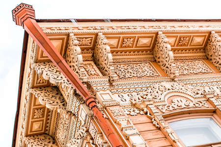 a wooden carved roof visor beautiful ancient Russian patternsの写真素材