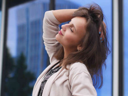 Portrait of a beautiful young woman outdoorsの写真素材