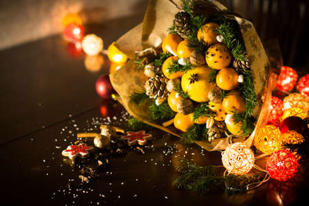 decoration of Christmas gifts, making bouquets of fruitsの写真素材