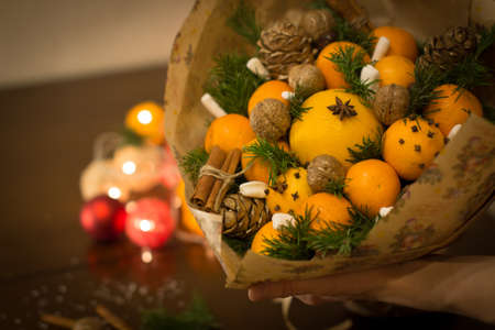 decoration of Christmas gifts, making bouquets of fruitsの写真素材