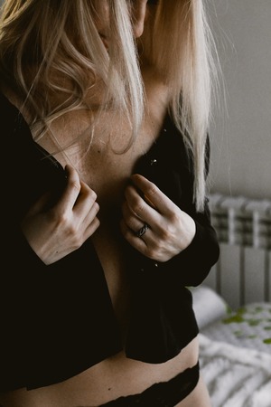 Sexy woman in lace underwear on the bed. sexy blonde in black lingerie
