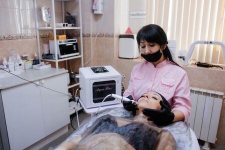 Russia, Novosibirsk, January 5, 2020. Woman lies with her eyes closed during the procedure in the...