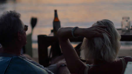 SAMUI, THAILAND - FEBRUARY 20, 2020: people relax in a beach cafe at all sunset timeのeditorial素材