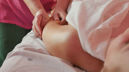 Hand massage procedure in the spa salon. Massage your fingers and wrist at the spa