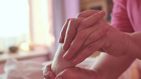Hand massage procedure in the spa salon. Massage your fingers and wrist at the spaの写真素材