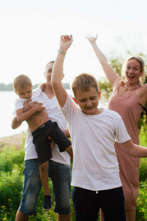Family resting together in summer outdoorsの写真素材