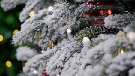 beautiful artificial Christmas tree in the store, close-up in motionの写真素材
