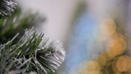 beautiful artificial Christmas tree in the store, close-up in motion