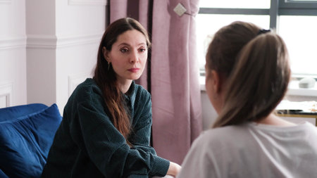 A woman psychotherapist conducts a reception in her office. The patient expresses her feelings in a one-on-one relationship with a specialist. Mental health conceptの写真素材