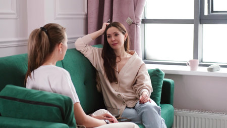 A woman psychotherapist conducts a reception in her office. The patient expresses her feelings in a one-on-one relationship with a specialist. Mental health conceptの写真素材