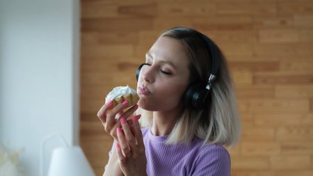 A beautiful girl in a homemade purple suit spends time alone at home. The girl listens to music on...