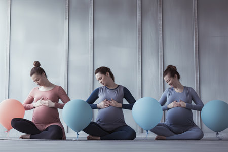 A group of pregnant women in tracksuits are doing gymnastics in a special roomの素材