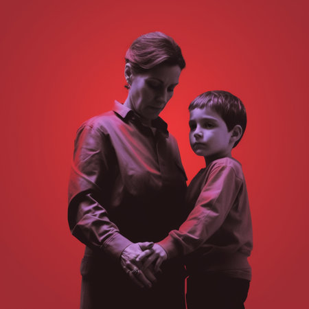 Strict upbringing of the child and total control. Woman and little son in co-dependent relationshipの素材