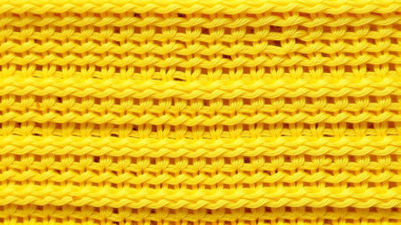 Texture of wool knitted fabric in bright yellow colorの素材