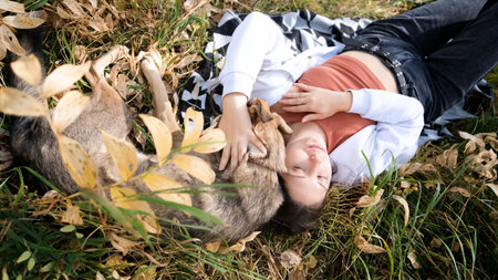 Young woman with a dog in an autumn setting