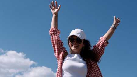 Teen girl eating outdoors.の写真素材