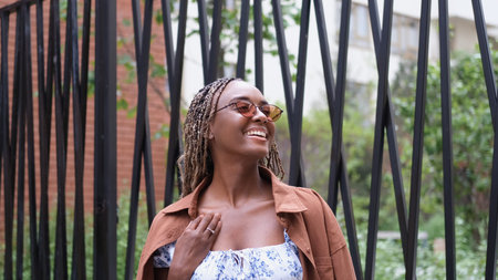 Portrait of a beautiful smiling woman in sunglassesの写真素材