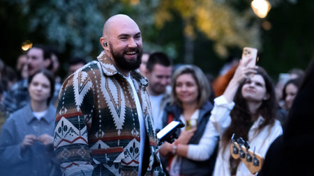 September 15, 2025. Russia, Novosibirsk. Street musicians perform in a city park during the summer...