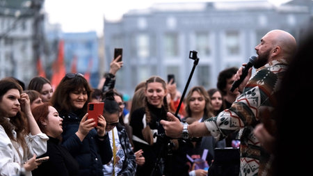 September 15, 2025. Russia, Novosibirsk. Street musicians perform in a city park during the summer...