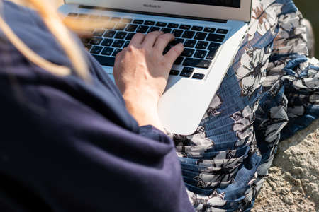 young girl is working on the bridgeの写真素材