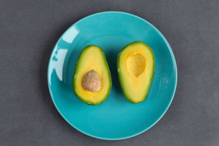 half avocado on a plate