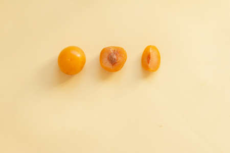 Yellow plums on a tableの写真素材