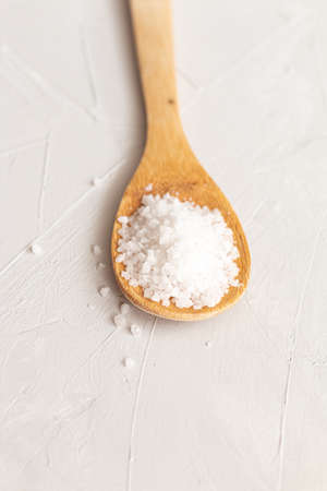 sea salt on a wooden background. Food ingredients isolated with space for textの写真素材