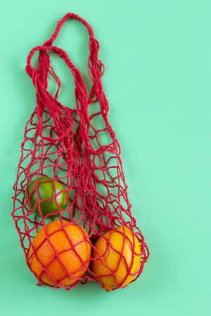 Conceptual bright colorful background with multicolour string bag. space for text.の写真素材