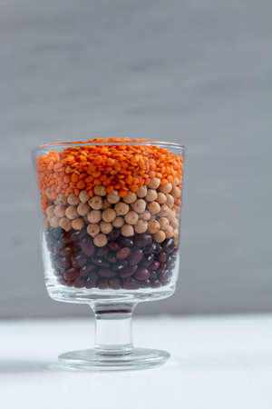 Trendy concept of multicolor beans including red kidney, chickpea, lentil. With space for textの写真素材