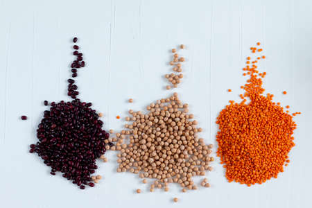 Trendy concept of multicolor beans including red kidney, chickpea, lentil. With space for textの写真素材