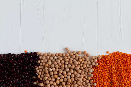 Trendy concept of multicolor beans including red kidney, chickpea, lentil. With space for textの写真素材