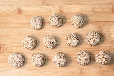 Homemade sweets energy balls made from superfoods like seeds, nuts and dried fruits. Healthy snack,...