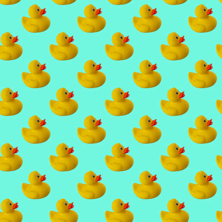 Digital seamless pattern of yellow rubber duck on green mint backgroundの写真素材