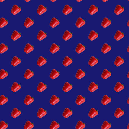 Red peppers seamless pattern on purple blue colorの写真素材
