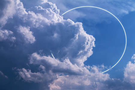 Sunset orange clouds on blue sky, film noise grain effectの写真素材