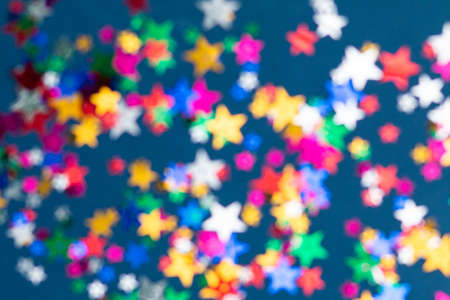 blurred seamless pattern with colorful stars, dark blue background, selective focusedの写真素材