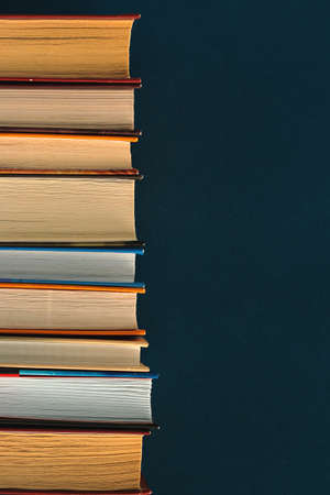 Stack of old vintage books in a library , retro tone and grain noise, vintage collectionの写真素材