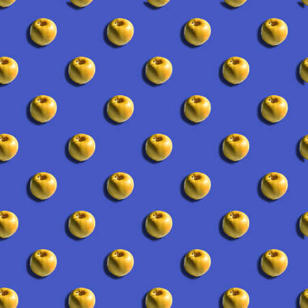 seamless pattern of yellow apple with shadow on purple background