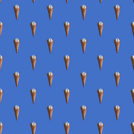Seamless pattern of ice cream cone, blue background. wrapping paper templateの写真素材