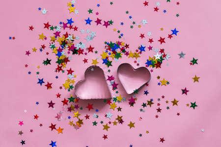 multicolored confetti on pink background, greeting card templateの写真素材