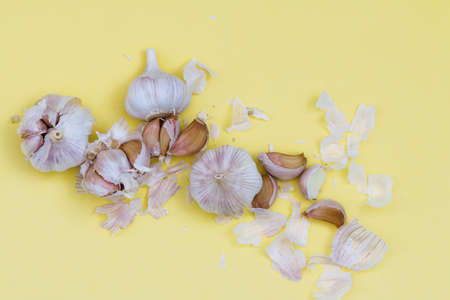 garlic on yellow background, alternative medicine virus protection conceptの写真素材