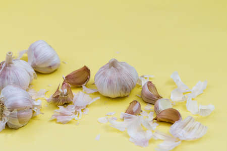 garlic on yellow background, alternative medicine virus protection conceptの写真素材