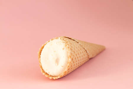 ice cream cone isolated on pink background, sweet summer food conceptの写真素材