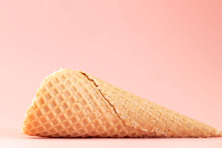 ice cream cone isolated on pink background, sweet summer food conceptの写真素材