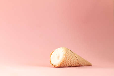 ice cream cone isolated on pink background, sweet summer food conceptの写真素材