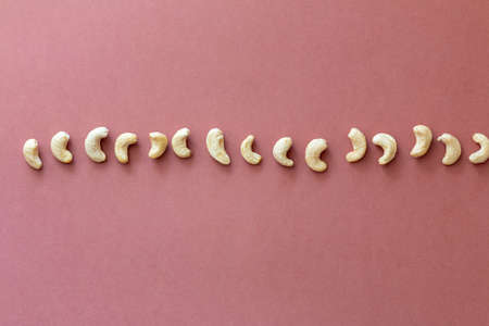 group of nuts on brown background, healthy food concept, empty space for textの写真素材