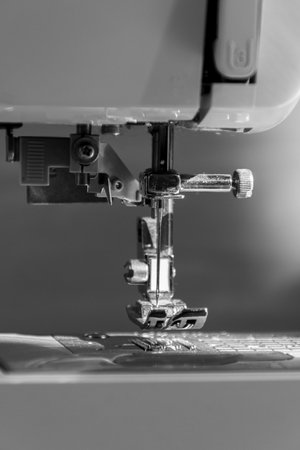 sewing machine close up view with natural sunlight, slow fashion and home sewing concept in black and whiteの写真素材
