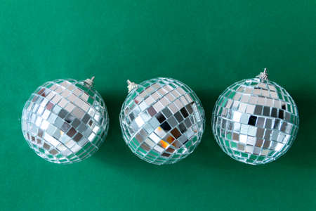 Disco ball against emerald green backgroundの写真素材