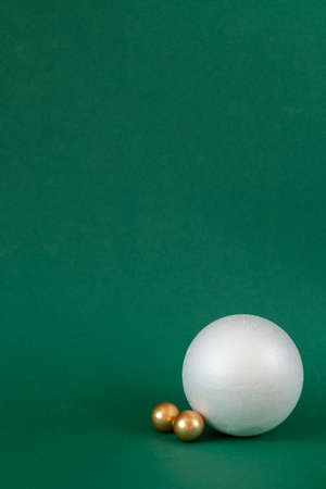 Christmas decoration on green background with empty space for textの写真素材