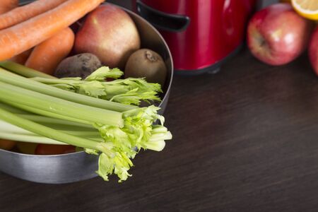juicing fresh beautiful bright vegetables and fruitsの写真素材